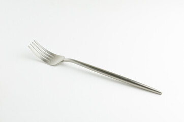 Silver fork on white background