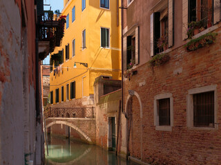 Fototapeta na wymiar A yellow building on the Rio de San Zanirovo canal, Venice, Italy