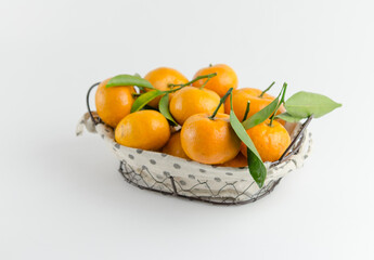 Fresh mandarin oranges fruit or tangerines with leaves on white background