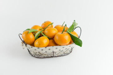 Fresh mandarin oranges fruit or tangerines with leaves on white background