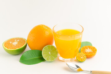 Citrus juice with many kinds of citrus fruits behind. Healthy and diet concept