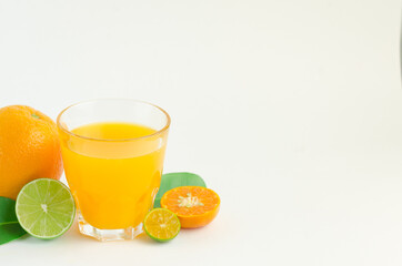Citrus juice with many kinds of citrus fruits behind. Healthy and diet concept