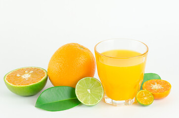 Citrus juice with many kinds of citrus fruits behind. Healthy and diet concept