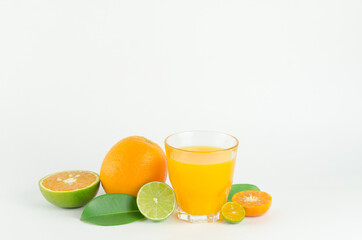 Citrus juice with many kinds of citrus fruits behind. Healthy and diet concept