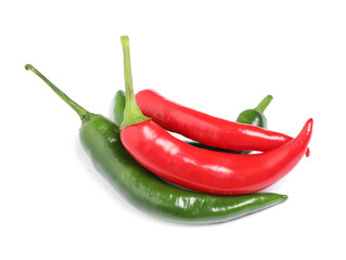 Ripe hot chili peppers on white background