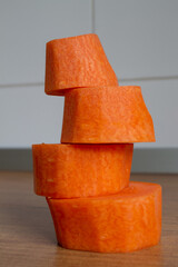 peeled carrots stacked in a pyramid