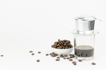 Vietnamese coffee with phin filter and coffee bean