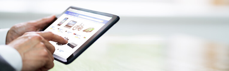 Hand Holding Tablet Purchasing Online
