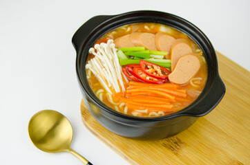 Korean kimchi soup  with sausage, chili, and vegetables