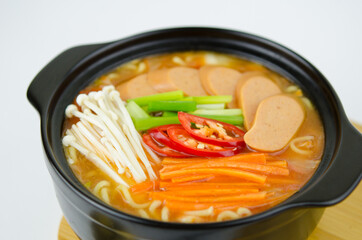 Korean kimchi soup  with sausage, chili, and vegetables