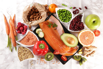 fruit, vegetable, fish, nut, cereal- balanced diet food background