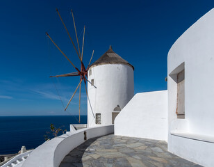 Old mills and courtyards of the white city of Oia on the island of Santorini. Greece.