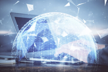 Multi exposure of businessman working on laptop on background. International business hologram in front. Concept of success.