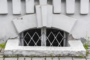 Small window of the basement with iron bars