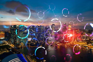 Hologram of abstract technology glowing icons, panoramic cityscape of Singapore at sunset, Asia....