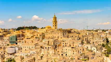 Fototapeta premium It's Panoramic view of Matera, Puglia, Italy. The Sassi and the Park of the Rupestrian Churches of Matera. UNESCO World Heritage site