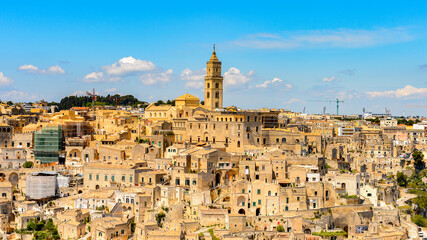 Naklejka premium It's Panoramic view of Matera, Puglia, Italy. The Sassi and the Park of the Rupestrian Churches of Matera. UNESCO World Heritage site