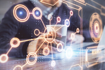Media network theme hologram with man working on computer on background. Concept of internet communication. Double exposure.