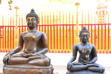 Buddha statue around the golden pagoda at Wat Prathat Doi Suthep. Chiang Mai, Thailand.