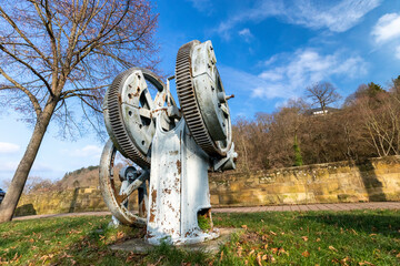 Historic water pump with gears on the Glan promenade in Meisenheim