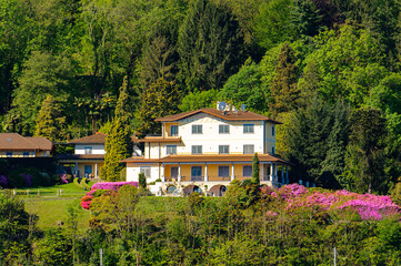 Fototapeta na wymiar It's Houses on the coast of the Lago Maggiore (Big Lake), Piedmont, Italy