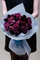Bouquet of flowers in blue transparent package