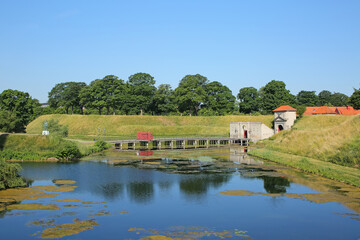 Fototapeta na wymiar Beautiful landscape of the Kastellet, or the citadel which is the original city gates complete with moat or lake located in Christianshavn, in the city center of Copenhagen, Denmark.