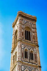 It's Giotto’s Campanile, a free-standing campanile, part of the complex of buildings that make up Florence Cathedral on the Piazza del Duomo in Florence, Italy.
