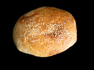 Closeup ciabatta bread on black background.