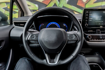 Closeup of steering wheel in interior of car