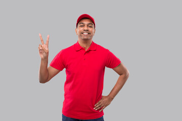 Delivery man Showing Peace Sign Isolated. Indian Delivery Boy Smilling Peace