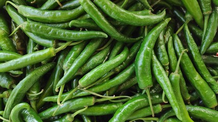 pile of green chili pepper background. full frame shoot