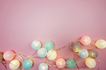 Fototapeta na wymiar Colorful LED cotton ball decorative on pink background