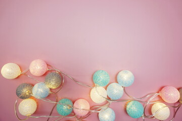 Colorful LED cotton ball decorative on pink background