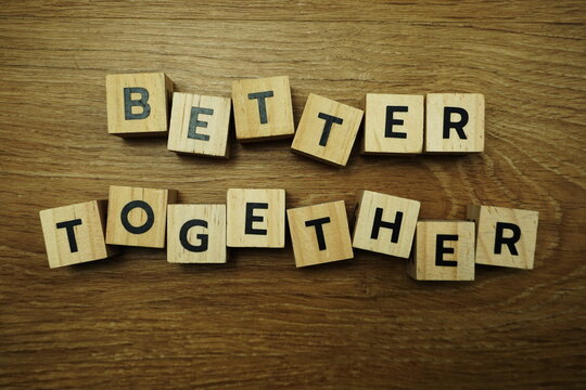 Better Together alhpabet letter on wooden bakground