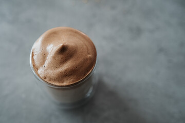 Top View of Glass Cup of Dalgona Coffee on the Table
