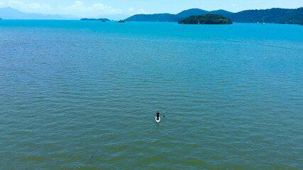 Stand up paddle surfing Atlantic ocean Paraty Brazil aerial view