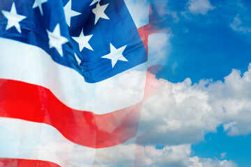 Double exposure American flag on the sunny blue white clouds background. copy space for text.