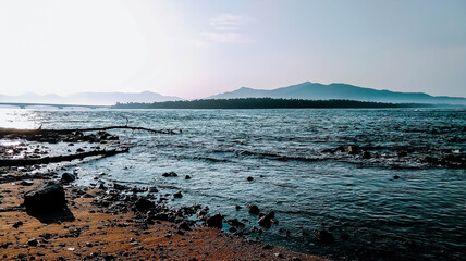 A beautiful lake with rocky shore.