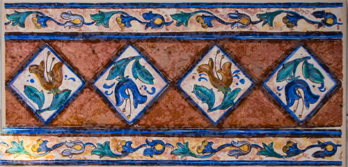 Detail of the traditional tiles from facade of old house. Decorative tiles.Valencian traditional tiles. Floral ornament.