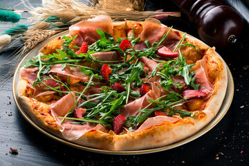 italian pizza with parma and strawberries