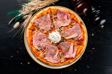 italian pizza with ham and poached egg top view, flat lay