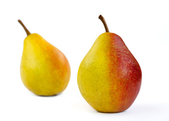 pear fruit, yellow fruits with red sides on a light background