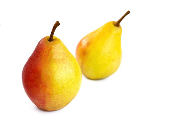 pear fruit, yellow fruits with red sides on a light background