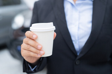Businessman is drinking hot coffee before leaving to work at the office every time.