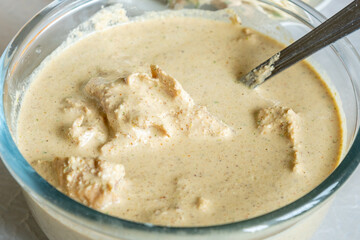 A Georgian dish satsivi in a glass bowl