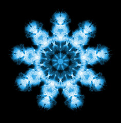Snowflake pattern isolated on black background. X ray effect.