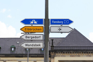Fototapeta premium Hamburg, Germany, road signs and signpost. Elbbrucken, Bergedorf, Wandsbek, Flensburg, airport