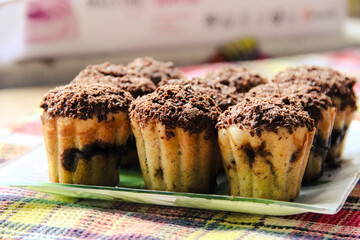 delicious cupcakes lie on a glass plate