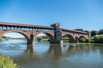 Fototapeta na wymiar The covered bridge over the Ticino river in Pavia